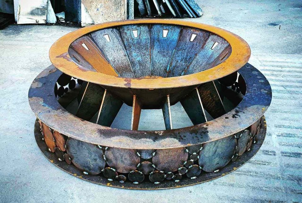 large fire pit made in Australia, with custom made base ring that could alternatively be used upright as a wood stacker
